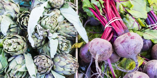 artichokes and beets in an open-air market