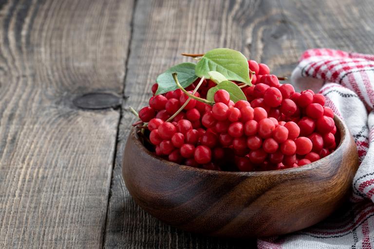 a bowl of schisandra berries